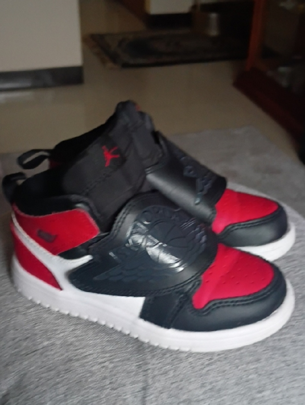 Jordan Kids High-Top Sneakers in Red, Black, and White